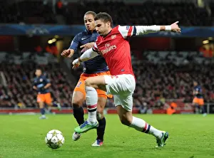 Arsenal V Montpellier 2012-13 Prints: Olivier Giroud (Arsenal) Daniel Congre (Montpellier). Arsenal 2: 0 Montpellier. UEFA