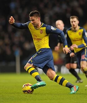 Images Dated 18th January 2015: Olivier Giroud: Arsenal's Battle at the Etihad vs. Manchester City, 2014-15