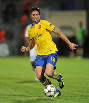 Images Dated 18th September 2013: Olivier Giroud: Arsenal's Champion Striker Shines in UEFA Champions League Clash against Olympique
