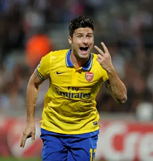 Marseille V Arsenal 2013-14 Prints: Olivier Giroud: Arsenal's Star Striker in Action against Olympique Marseille