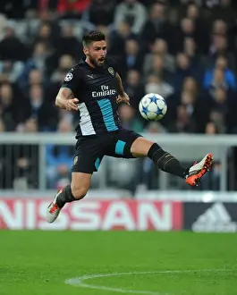 Bayern Munich V Arsenal 2015-16 Prints: Olivier Giroud: Arsenal's Unyielding Striker in the Heart of the Bayern Munich Battle