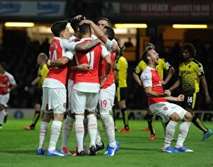 Images Dated 17th October 2015: Olivier Giroud celebrates scoring Arsenals 2nd goal with his team mates. Watford 0