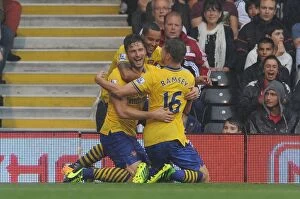 Images Dated 24th August 2013: Olivier Giroud, Theo Walcott, and Aaron Ramsey Celebrate Arsenal's First Goal vs. Fulham (2013-14)