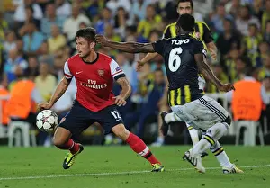 Fenerbahce V Arsenal 2013-14 Prints: Olivier Giroud vs. Joseph Yobo: Arsenal's Edge in UEFA Champions League Play-offs against Fenerbahce