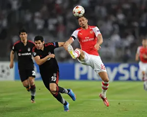 Besiktas V Arsenal 2014-15 Prints: Olivier Giroud vs Pedro Franco: Intense Battle in Arsenal's UEFA Champions League Clash with Besiktas