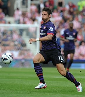 Stoke City v Arsenal 2012-13 Collection: Olivier Giroud's Brilliant Performance: Arsenal Overpowers Stoke City in Premier League 2012-13