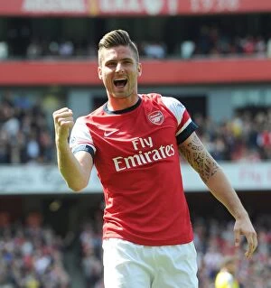 Arsenal v West Bromwich Albion 2013-14 Collection: Olivier Giroud's Euphoric Goal Celebration: Arsenal's Victory Against West Bromwich Albion