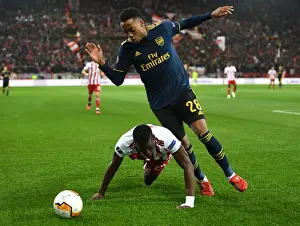 Olympiacos vs. Arsenal: Europa League Clash - Joe Willock Faces Off Against Ousseynou Ba