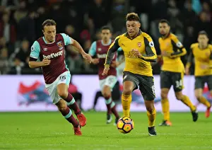 Olympic Stadium Prints: Oxlade-Chamberlain Outwits Noble: Arsenal's Midfield Genius Shines in Premier League Clash