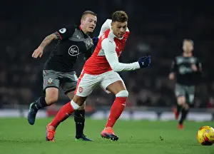 Arsenal V Southampton EFL Cup 2016-17 Prints: Oxlade-Chamberlain vs Clasie: A Battle in the EFL Cup Quarter-Final between Arsenal and Southampton