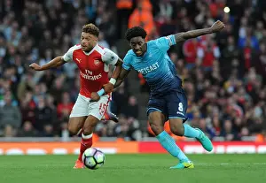 Arsenal V Swansea City 2016-17 Prints: Oxlade-Chamberlain vs. Fer: A Premier League Battle at Emirates Stadium