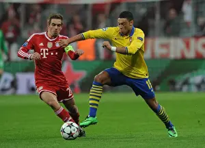 Bayern Munich V Arsenal 2013-14 Prints: Oxlade-Chamberlain vs. Lahm: The Battle at the Allianz Arena - Arsenal vs