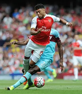 Arsenal V West Ham United 2015-16 Prints: Oxlade-Chamberlain vs. Ogbonna: A Premier League Battle at Emirates Stadium
