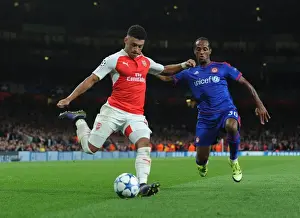 Arsenal V Olympiacos 2015/16 Prints: Oxlade-Chamberlain vs. Salino: A Champions League Showdown