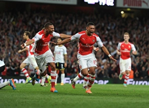 Oxlade-Chamberlain's Last-Minute Thriller: Arsenal Edges Past Tottenham in Intense 2014-15 Premier League Clash