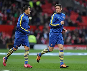 Manchester United V Arsenal 2013-14 Prints: Ozil and Giroud: Pre-Match Chat Between Arsenal Stars at Old Trafford (Manchester United vs Arsenal)