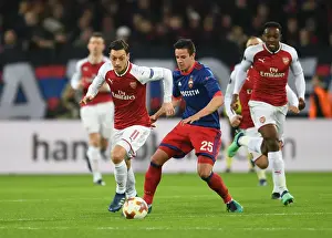 CSKA Moscow V Arsenal 2017-18 Prints: Ozil vs. Bistrovic: A Battle in the Europa League Quarterfinals between CSKA Moscow and Arsenal FC