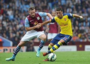 Aston Villa V Arsenal 2014-15 Prints: Ozil vs. Cleverley: A Battle at Villa Park, 2014-15 Premier League
