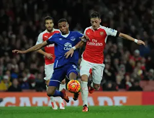Arsenal V Everton 2015/16 Prints: Ozil vs. Galloway: A Premier League Battle at Emirates Stadium