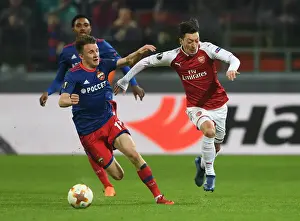 CSKA Moscow V Arsenal 2017-18 Prints: Ozil vs. Golovin: Europa League Showdown between CSKA Moscow and Arsenal FC
