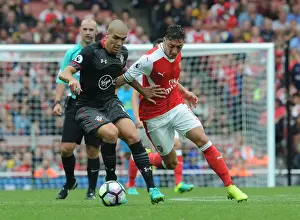 Arsenal V Southampton 2016-17 Prints: Ozil vs. Romeu: Intense Face-Off in Arsenal's Battle Against Southampton