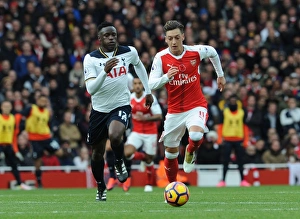 Arsenal V Tottenham Hotspur 2016-17 Prints: Ozil vs. Wanyama: A Footballing Battle in the Arsenal vs. Tottenham Rivalry (2016-17)