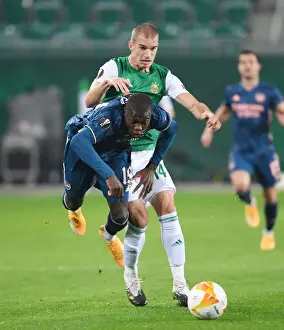 Rapid Vienna V Arsenal 2020-21 Prints: Partey Foul: Intense Clash Between Rapid Vienna and Arsenal FC in Europa League