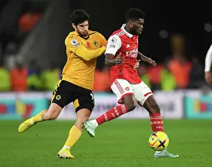 Wolverhampton Wanderers V Arsenal 2022-23 Prints: Partey vs Guedes: Intense Battle in Wolverhampton Wanderers vs Arsenal FC Premier League Clash