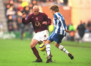 Images Dated 21st November 2005: Pascal Cygan (Arsenal) Jimmy Bullard (Wigan)