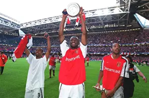 Patrick Vieira, Thierry Henry and Ashley Cole celebrate after the match