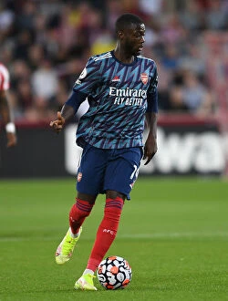 Images Dated 14th August 2021: Pepe in Action: Brentford vs Arsenal, 2021-22 Premier League