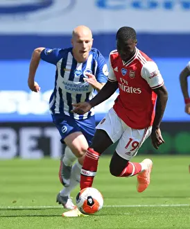 Brighton And Hove Albion V Arsenal 2019-20 Prints: Pepe Breaks Past Mooy: Empty Stadium Showdown - Brighton vs