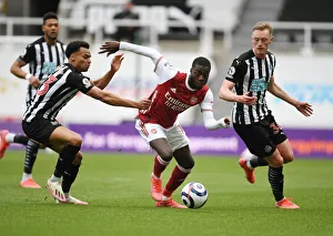 Newcastle United V Arsenal 2020-21 Prints: Pepe Faces Off Against Murphy and Longstaff: Newcastle vs