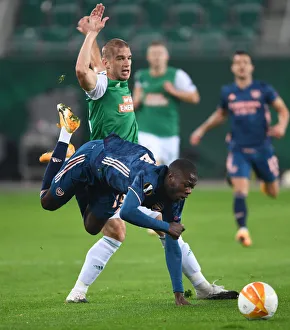 Rapid Vienna V Arsenal 2020-21 Prints: Pepe Foul: Intense Moment in Rapid Vienna vs. Arsenal UEFA Europa League Clash