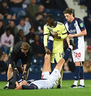 West Bromwich Albion V Arsenal - Carabao Cup 2021-22 Prints: Pepe and Reach Show Sportsmanship: West Bromwich Albion vs. Arsenal in Carabao Cup
