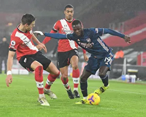 Pepe vs Bednarek: Empty St Mary's Showdown - Arsenal's Nicolas Pepe Clashes with Southampton's Jan Bednarek in Premier League's Empty Stadiums (2021)