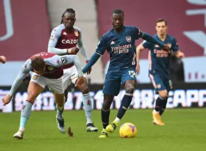 Aston Villa V Arsenal 2020-21 Prints: Pepe vs. Cash: A Premier League Showdown in Empty Villa Park Amidst the Pandemic