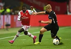 Eintracht Frankfurt V Arsenal 2019-20 Prints: Pepe vs Hinteregger: A Europa League Battle at Frankfurt