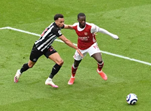Newcastle United V Arsenal 2020-21 Prints: Pepe vs Murphy: A Battle Unfolds at Empty St
