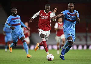 Arsenal v West Ham United 2020-21 Collection: Pepe vs Ogbonna: Intense Battle in Arsenal vs West Ham Premier League Clash