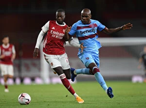 Arsenal v West Ham United 2020-21 Collection: Pepe vs. Ogbonna: Intense Clash in Arsenal's Battle Against West Ham