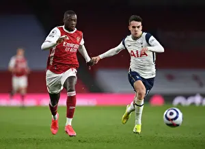 Arsenal V Tottenham Hotspur 2020-21 Prints: Pepe vs. Reguilon: A Winged Showdown in the Arsenal-Tottenham Rivalry