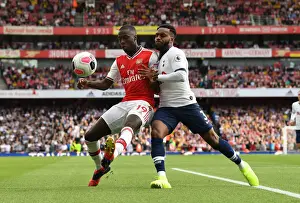 Arsenal V Tottenham Hotspur 2019-20 Prints: Pepe vs. Rose: A Football Rivalry Ignites in Arsenal vs. Tottenham Showdown