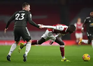 Arsenal V Manchester United 2020-21 Prints: Pepe vs Shaw: Premier League Showdown at Empty Emirates Stadium - Arsenal vs Manchester United 2021