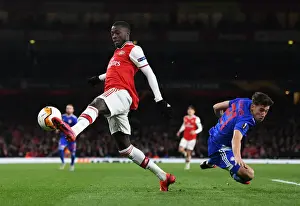 Arsenal V Olympiacos 2019-20 Prints: Pepe vs Tsimikas: A Europa League Battle at Arsenal's Emirates Stadium