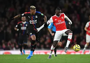 Arsenal V Crystal Palace 2019-20 Prints: Pepe vs van Aanholt: A Premier League Showdown at Emirates Stadium