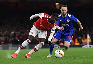 Arsenal V Olympiacos 2019-20 Prints: Pepe vs. Vilbuena: Clash in the Europa League between Arsenal and Olympiacos