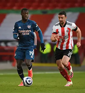 Pepe's Powerful Run: Arsenal's Thrilling Victory at Empty Bramall Lane vs. Sheffield United, Premier League 2020-21