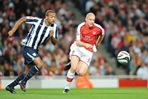 Images Dated 22nd September 2009: Philippe Senderos (Arsenal) Luke Moore (WBA)