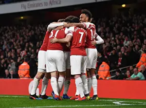 Pierre-Emerick Aubameyang celebrates Arsenals 1st goal scored by Mesut Ozil with his team mates